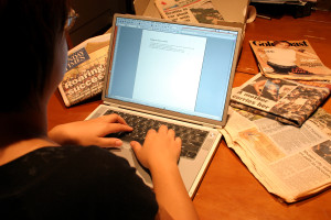 A person typing on a laptop.